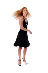 Beautiful woman in black dress dancing