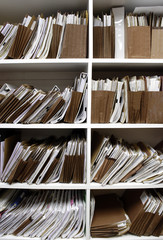 Office shelves full of files and boxes