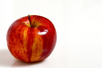 fine image of red apple on white plane