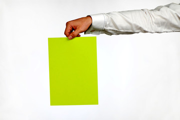 hand of businessman with green sheet of paper