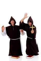 Holiday Halloween scene, two priests in habit.