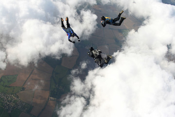 Three skydivers in  freefall