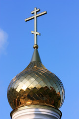 Domes of orthodox church on a blue sky background.