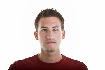 Fototapeta premium A young man in a red shirt with serious expression