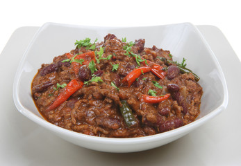 A bowl of hot chilli con carne with bird's eye peppers