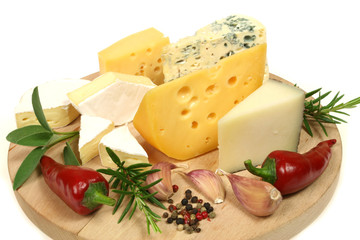Cheese and herbs on a wooden board. Food photography.