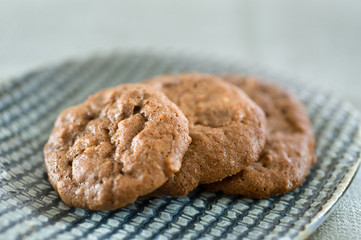 closeup on three health chocolate cookies