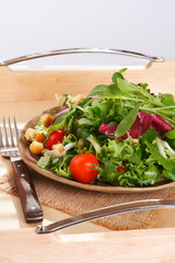 green leaves salad on serving tray