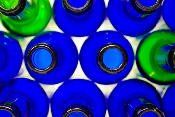 A shot of some blue and green bottles in transmitted light