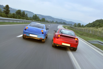 Fototapeta na wymiar speed fast car racing on highway captured with long exposure