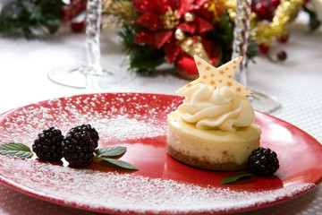 Vanilla Bean Cheesecake with fresh blackberries and mint