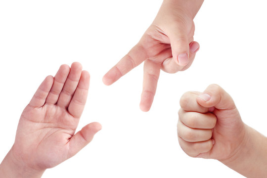 Children' hands playing rock, paper and scissors game