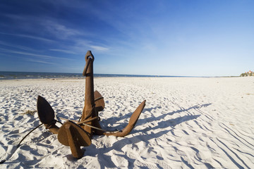 the big anchor on the sand beach