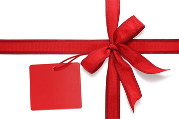 Red bow with label isolated on white background