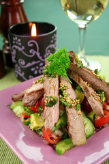 Lamb fillet with tomato, cucumber and avocado