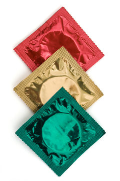 Condom Wrappers in Traffic Light Colours on White Background