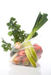 grocery-bag with vegetables and fruits isolated on a white