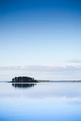 Foto op Plexiglas Alone island on the lake at sunset © Antti Karppinen