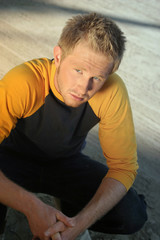 blond blue collar guy in the sun