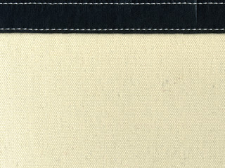 canvas with leather strip and stitching