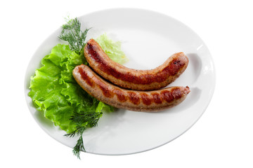 grilled sausage with lettuce isolated on white