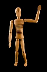 A wooden armature waves hello