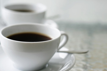 Two cups of black coffee