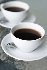 Two cups of black coffee