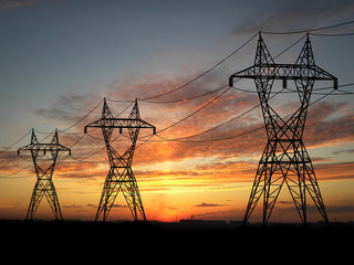 Fototapeta premium Electric powerlines over sunrise