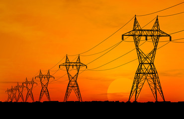 Naklejka premium 3D Electric powerlines over sunrise
