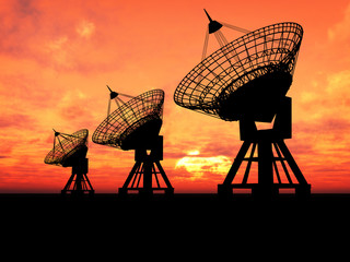 Three satelite dishes over sunset - 9699248