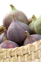 Fototapeta premium basket of fresh figs isolated on white