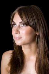 Fototapeta premium Portrait of the young beauty woman. Isolated on black background