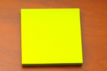 set of  paper of flavovirent color for notes on  table