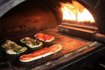 Pizza Sticks Baking in an Open Oven