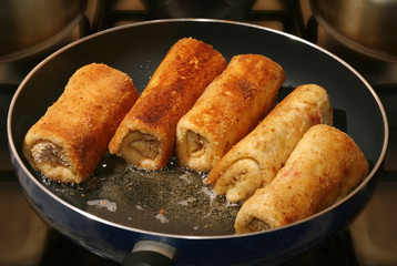 real photo golden pancakes and hot oil on pan