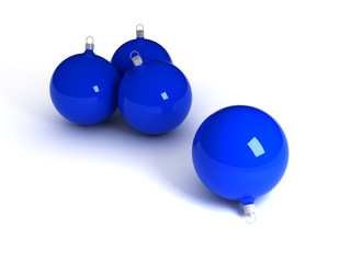 Four glossy blue christmas balls over white