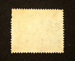 Blank postage stamp on black background