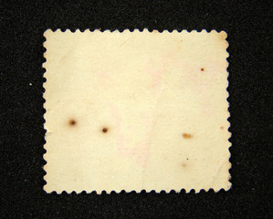 Blank postage stamp on black background