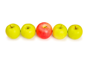Stand out from crowd concept with apples isolated on white