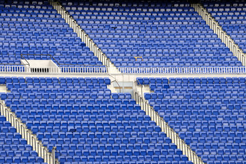 Naklejka premium Blue seats in an empty stadium