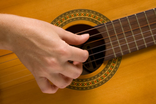 musician plays a musical instrument,guitarist and a guitar