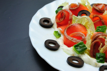 salmon salad on white plate