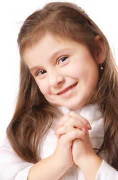 Smiling girl who is thinking or praying. Isolated