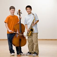 Musicians standing with cello and saxophone