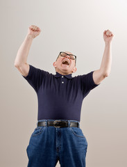 Excited man cheering and celebrating his success