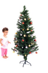 Little Child Looking a Christmas Tree .
