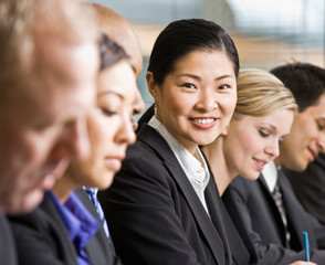 Multi-ethnic co-workers sitting in a row