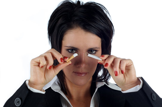 Business woman breaking a cigarette