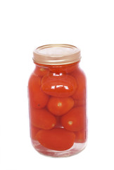 Canned tomatoes in a jar isolated on white